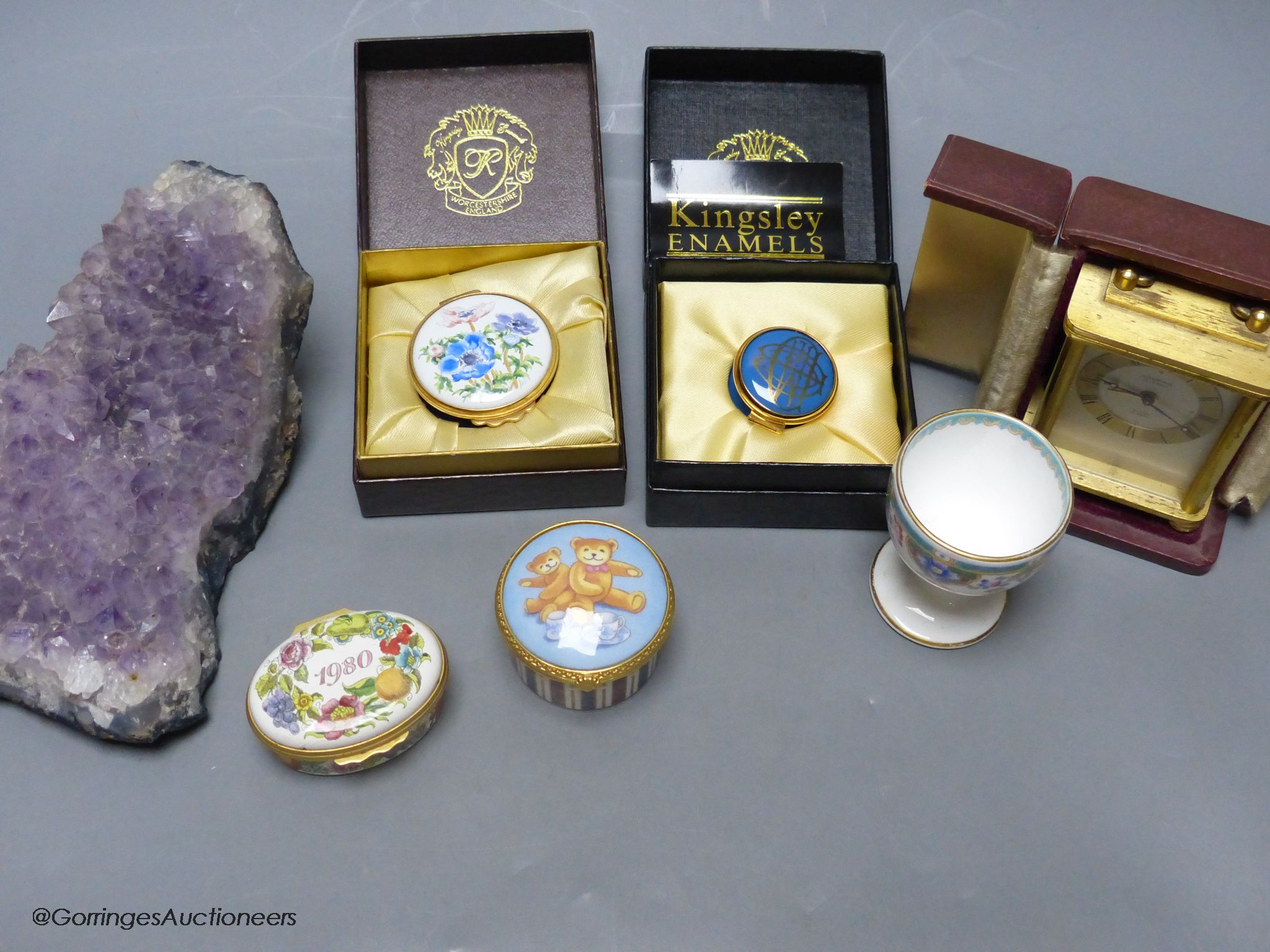 A small group of collectables including trinket boxes, a Mintons egg cup, a Lupin carriage timepiece and a piece of amethyst quartz